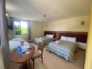 Postel nebo postele na pokoji v ubytování Hotel Cañada Internacional + 37 fotografií