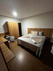 Ένα ή περισσότερα κρεβάτια σε δωμάτιο στο Casa chalé de Praia em condomínio - São Luís