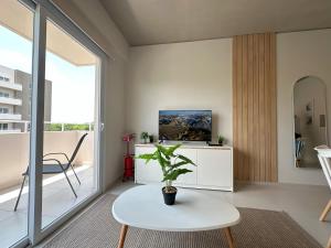 TV a/nebo společenská místnost v ubytování Republica Apartment
