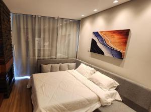 Ένα ή περισσότερα κρεβάτια σε δωμάτιο στο Aconchegante Flat Serra Class +28 φωτογραφίες