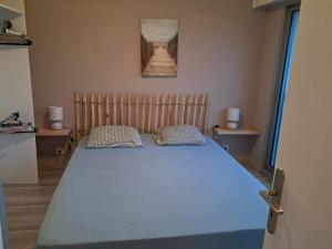 Ένα ή περισσότερα κρεβάτια σε δωμάτιο στο Appartement 1 chambre face aux dunes
