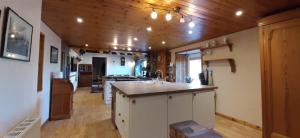 a kitchen with a sink and a counter top at Marshill Farmhouse in Blackwood
