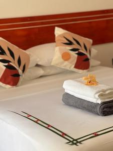 Postel nebo postele na pokoji v ubytování Thoddoo Cozy Stay