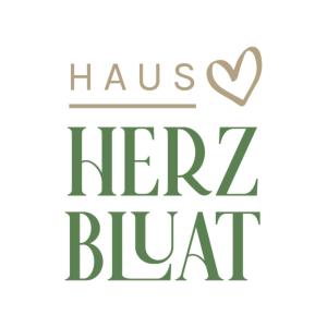 a handwritten inscription of a heart and the words have herzazi blackart at Haus Herzbluat in Peiting