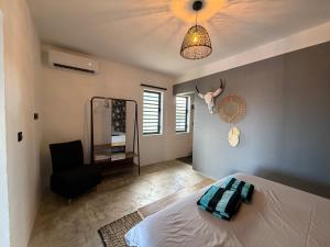 Voodi või voodid majutusasutuse Jayhden New Stay & Pool with Ocean View Curaçao toas