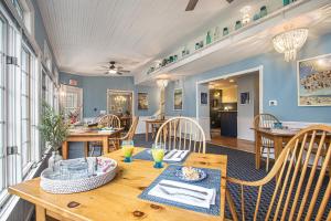 a dining room with a wooden table and chairs at Inn at the Park Bed and Breakfast in South Haven