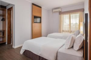 Voodi või voodid majutusasutuse Piazza Navona Porto Alegre by Intercity toas