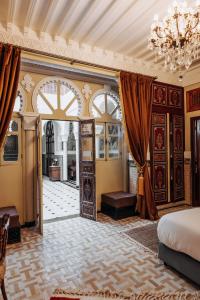 Postel nebo postele na pokoji v ubytování Riad Ksar Al Amal & Spa