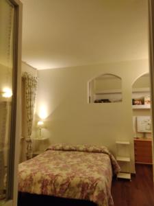 A bed or beds in a room at Casa Vacanza Villa Filomena
