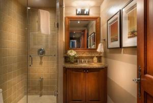 a bathroom with a shower and a sink at Bondurant 95-8 Village at Doorstep in Mont-Tremblant +4 photos