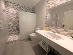 a bathroom with a sink and a toilet at Apartamento Martin in Tossa de Mar