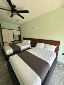 Voodi või voodid majutusasutuse Hotel Mariel Holbox toas