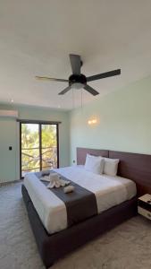Postel nebo postele na pokoji v ubytování Hotel Mariel Holbox