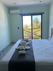 Postel nebo postele na pokoji v ubytování Hotel Mariel Holbox + 33 fotografií