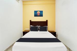 Super Collection O Calvathy Road Near Fort Kochi客房内的一张或多张床位