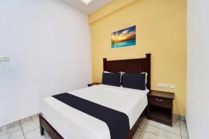 Super Collection O Calvathy Road Near Fort Kochi客房内的一张或多张床位