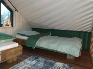 Ένα ή περισσότερα κρεβάτια σε δωμάτιο στο Forest View Lodge Diessen +16 φωτογραφίες