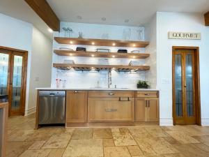 a kitchen with a sink and a dishwasher at Midtown Atlanta 6 Bed with pool and a view in Atlanta +40 photos