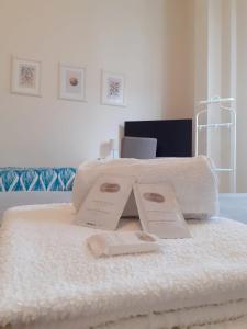 A bed or beds in a room at Mamamia #Politeama
