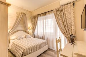Un pat sau paturi într-o cameră la Casa Tua Vaticano Guest House