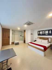 Postel nebo postele na pokoji v ubytování Hotel Portal Central