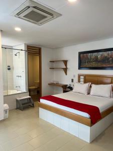 Postel nebo postele na pokoji v ubytování Hotel Portal Central