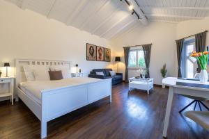 En eller flere senge i et værelse på Ferienwohnung B2