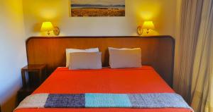 Cama ou camas em um quarto em Koi Aiken