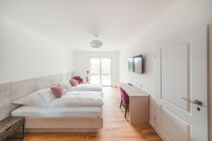 Postel nebo postele na pokoji v ubytování Hotel Magnolie GmbH