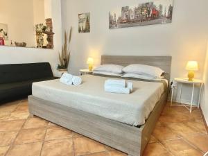 Ένα ή περισσότερα κρεβάτια σε δωμάτιο στο Maison Ursino