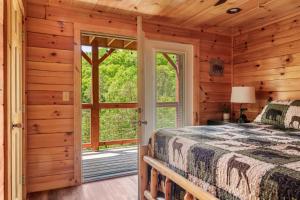 a bedroom with a bed and a large window at Heavenly Bliss By Ghosal Luxury Lodging in Sevierville +48 photos