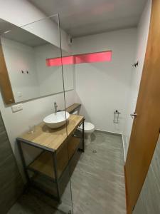 a bathroom with a sink and a toilet at Apartaestudio comodo y central S3 - WiFi in Pasto