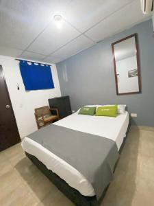 Postel nebo postele na pokoji v ubytování Hotel Puerto Vigia Inn