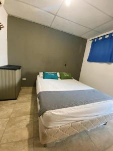 Postel nebo postele na pokoji v ubytování Hotel Puerto Vigia Inn
