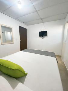Postel nebo postele na pokoji v ubytování Hotel Puerto Vigia Inn