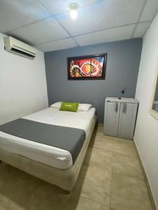 Postel nebo postele na pokoji v ubytování Hotel Puerto Vigia Inn