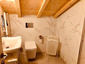 a bathroom with a sink and a toilet and a shower at Villa Bacchus in Nikiti +41 photos