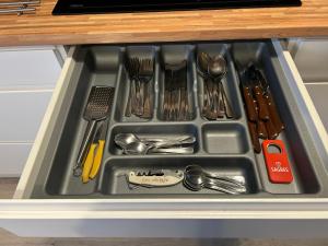 a tray filled with utensils in a drawer at El Hidalgo in Almagro