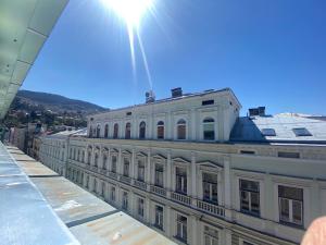 a building with the sun on top of it at Golden Soul Sarajevo Old town - Walk everywhere in Sarajevo