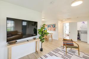 a living room with a couch and a table at Walk to Cowboys Games Arlington Home with Pool! in Arlington