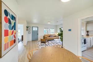 a kitchen and a living room with a table at Walk to Cowboys Games Arlington Home with Pool! in Arlington