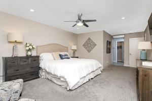 a bedroom with a bed and a ceiling fan at Endless Summer - SUR149 in Solana Beach +47 photos