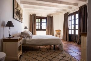 a bedroom with a bed and a large window at Casa Margarita Soo in Soo +67 photos