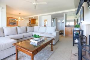 a living room with a white couch and a coffee table at Pacific Perch - SUR115S in Solana Beach