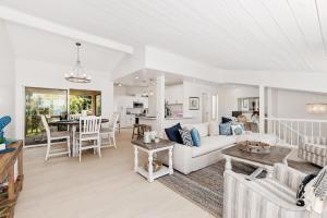 a living room with a couch and a table at Solana Escape - SUR44 in Solana Beach