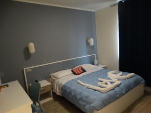 Postel nebo postele na pokoji v ubytování Hotel Moderno