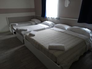 Postel nebo postele na pokoji v ubytování Hotel Moderno