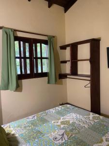 En eller flere senge i et værelse på Cabañas el Gauchito