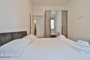 Ένα ή περισσότερα κρεβάτια σε δωμάτιο στο Arcos - 10 minutes walk to Piazza Maggiore