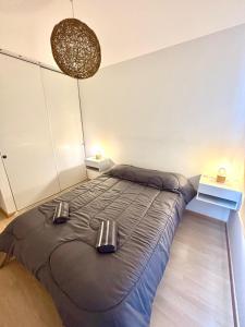 a bedroom with a large bed in a room at Amoblado Temporal M&S 4 M in Neuquén +30 photos
